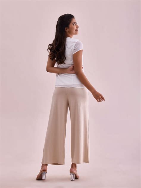 Women Solid Light Beige Viscose Mid Rise Knit Palazzos