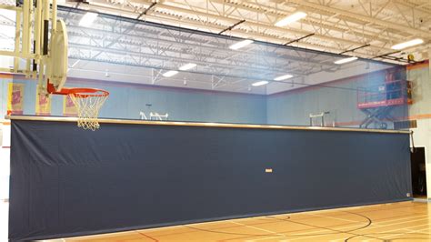 Installing a New Gym Divider Curtain for St. Gregory Catholic School