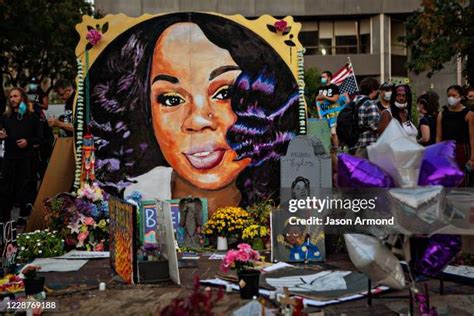 People gather at Breonna Taylors make shift memorial in Injustice Square Park in downtown Louisville