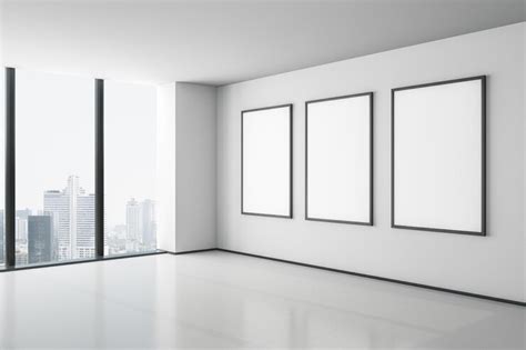 Blank white mock up three posters on white wall in modern empty room ...