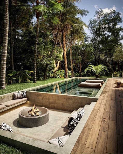 Modern Outdoor Living Area with Fire Pit and Pool Seating