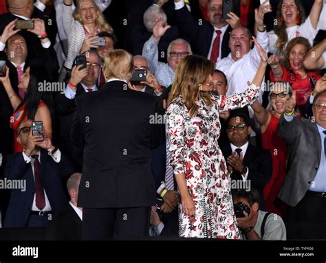 President Donald Trump and First Lady Melania Trump walk on stage ...