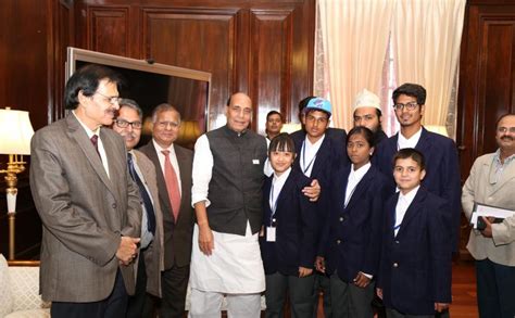 A group of children pinned flag on the Union Home Minister, Shri ...