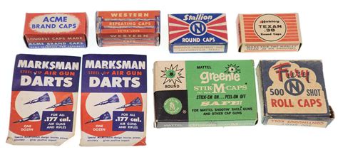 Lot - (8) Vintage Cap Gun Caps, Air Gun Darts, Acme