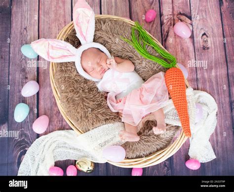 Sleeping, newborn baby. Easter bunny baby costume. Premature baby Stock Photo - Alamy
