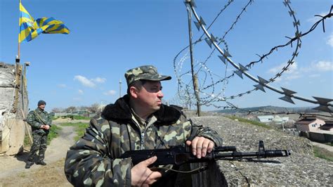 Pro-Russian forces storm Ukrainian base in Crimea