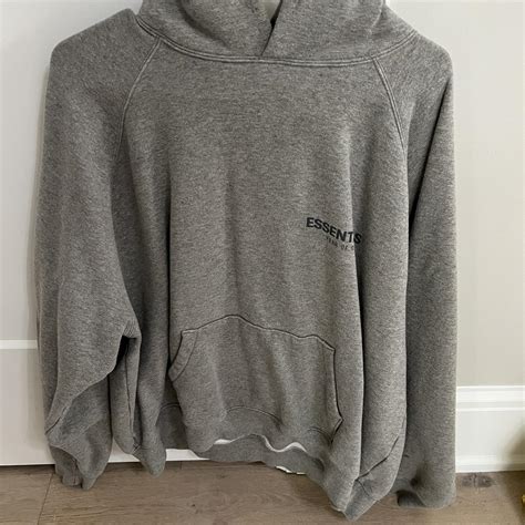 Grey essentials hoodie size L - Depop