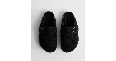 Black Buckled Borg Mule Slippers | New Look