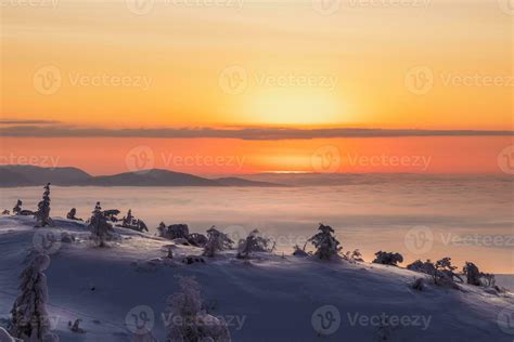 The sun is rising. Predawn morning on a winter slope. Beautiful Arctic ...