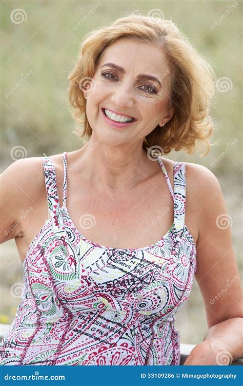 Portrait of a Beautiful Older Woman Smiling Outdoors Stock Photo ...
