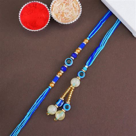 Send Evil Eye Bhaiya Bhabhi Rakhi Set Online | Rakhibazaar.com