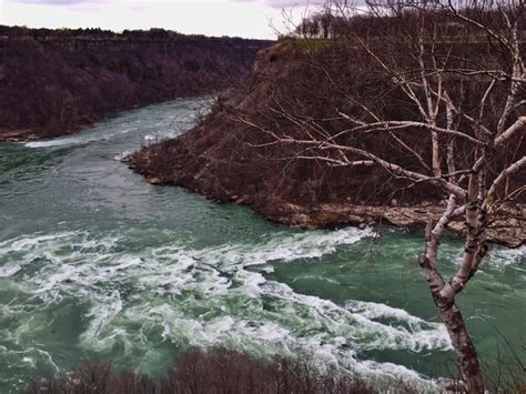 Scenic view of river and mountains | Premium Photo