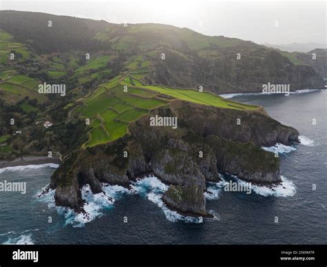 green grassland and rock land landscape of the Azores islands in the Atlantic ocean, touristic ...