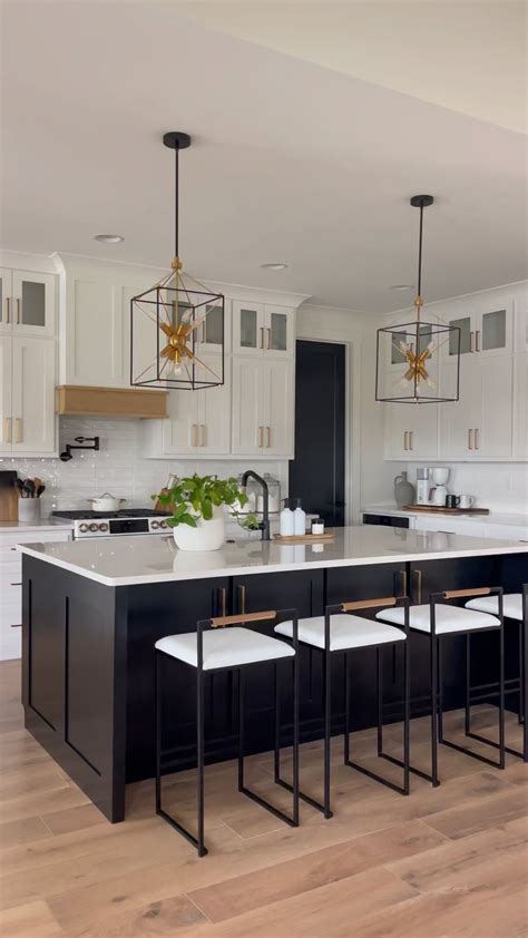 A Stunning Kitchen with White Cabinets and Black Island