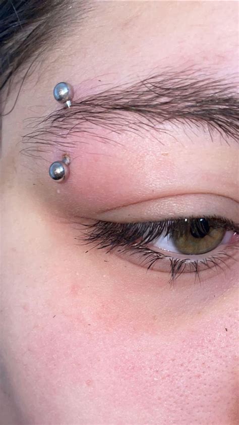 Is my eyebrow piercing rejecting or infected?? : r/piercing