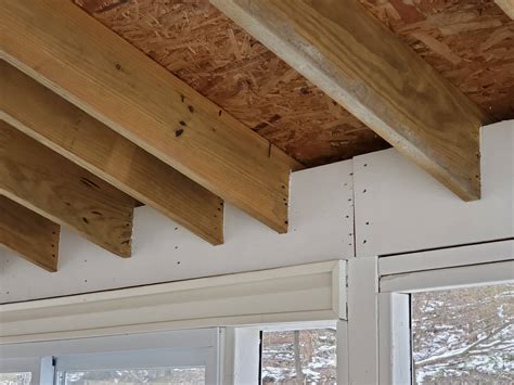 Attaching double 2x10 beams to 4x4 post - Home Improvement Stack Exchange
