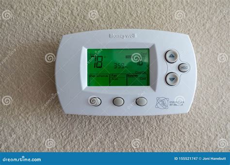A Honeywell Programmable Thermostat To Control The Air Conditioner And ...
