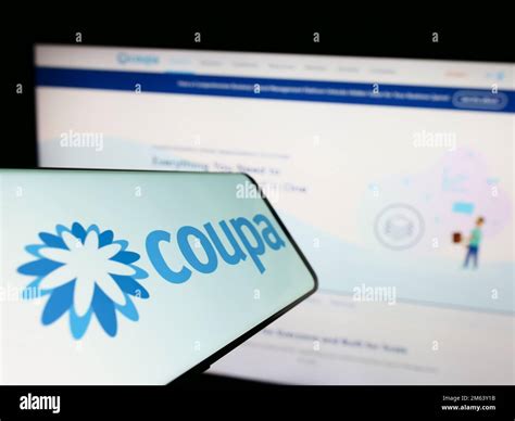 Mobile phone with logo of spend management company Coupa Software Inc. on screen in front of ...