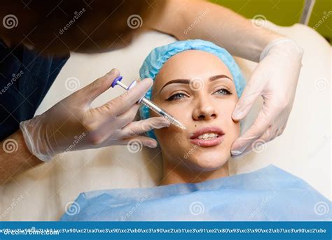 Woman Makes Rejuvenating Facial Injections Procedure for Lips Augmentation. Plastic Surgery in ...
