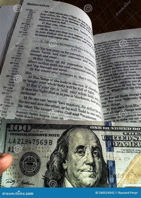 The Holy Bible in English with a Tab from the $ 100 Banknote Showing a Passage from the Gospel ...