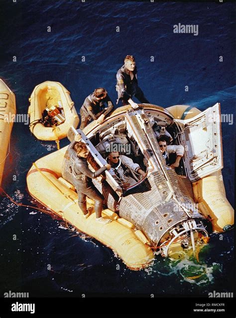 Navy divers rescue the space capsule of Gemini 8 after its splashdown ...