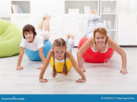 People Using Large Exercise Balls Stock Photo - Image of floor, girl ...