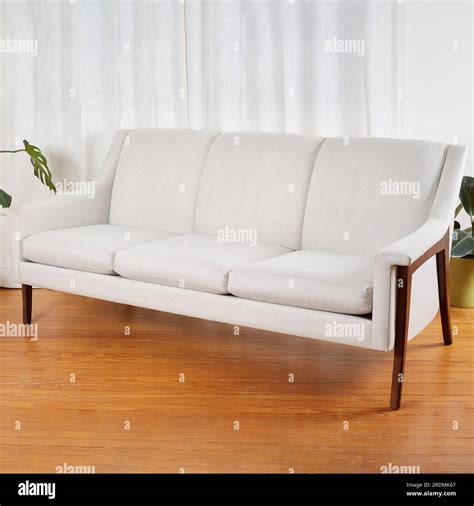 Vintage white sofa. Stylish mid-century modern couch with sculptural ...