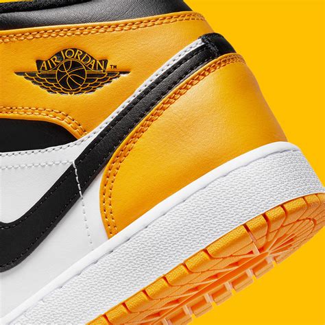 Black yellow jordan 1 mid online