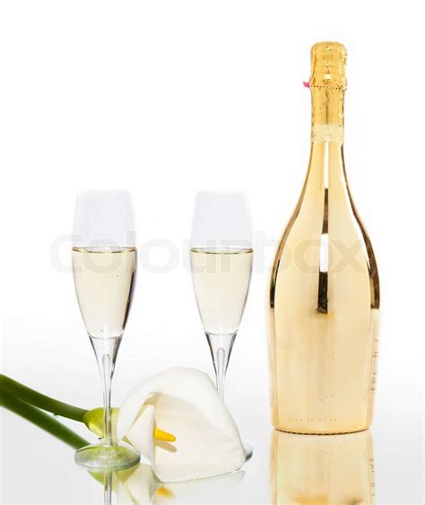 two glasses of champagne calla and a champagne bottle of gold | Stock image | Colourbox