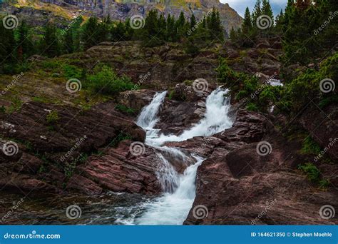 Red Rock Falls at Many Glacier, Glacier National Park Photo stock ...