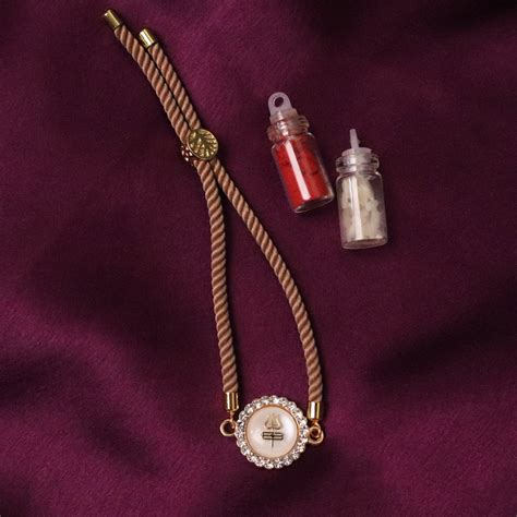 Trishul Charm Braclet Rakhi (Roli+Chawal) – The Advitya