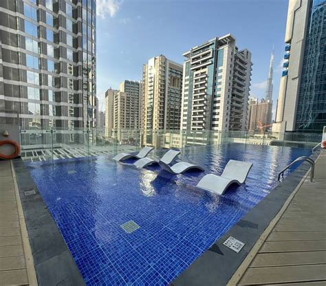 Stay in Style| Rooftop Pool with Iconic Burj Views - Apartments for ...