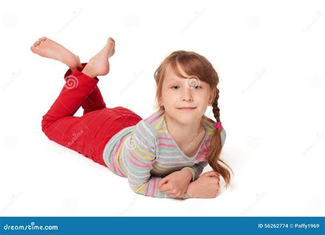 Front View Of Smiling Child Girl Lying On Floor Stock Photo - Image: 56262774