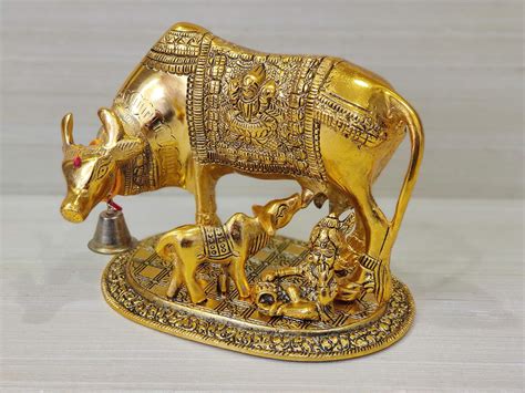 Buy GiftNagri Gold Plated Metal Handicraft Kamdhenu Cow Calf Showpiece ...
