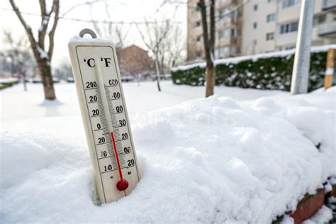 Thermometer on Snow Shows Low Temperatures - Zero. Low Temperatures in ...