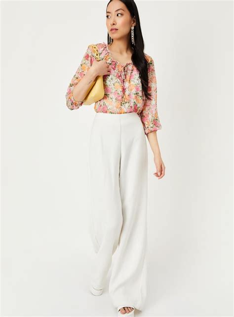 Buy Women Printed Tie-Up Neck Top Online at just Rs. 799.0 ...