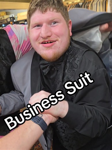 Another FIRST for Brett! 🤵❤️ Took my boy to get fitted for a suit for his sister's wedding! The place was cramped, and Brett wasn't having anything to do with that jacket! 😂 But we got his measurements, and Dad got another memory to cherish forever. ❤️ November 28th, I get to walk my daughter down the aisle, and Brett's going to be one sharp-dressed man! 🥹❤️ #LifeWithBrett #AngelmanSyndrome #SpecialNeedsFamily #WeddingDay #MakingMemories
