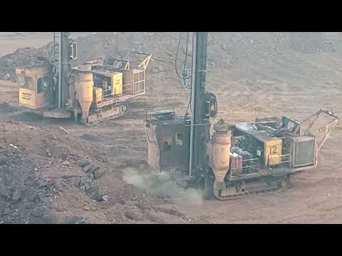 Operation of the drilling machine in iron ore mines. How mining is occurring in open cast mines