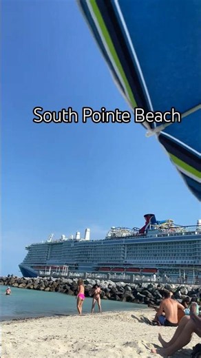 Windy afternoon at the Miami Beach jetty as a Carnival ship glides through Government