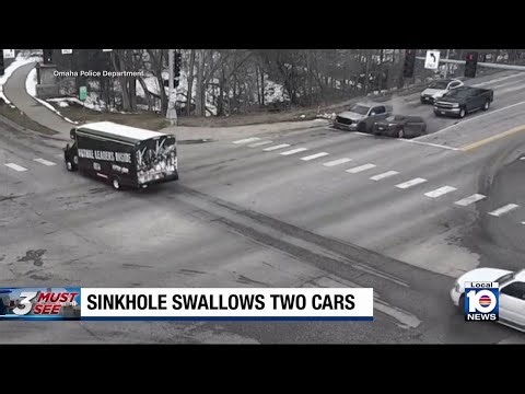 Pair of cars sitting at red light suddenly swallowed into sinkhole