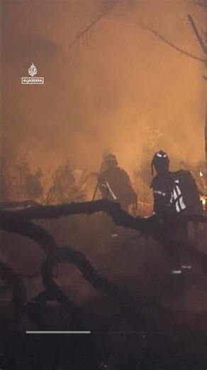 Firefighters race to contain flames in northeastern Spain