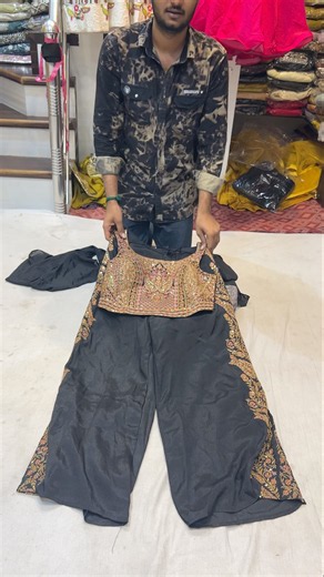 Step into the world of sophisticated ethnic fashion with this stunning Black Sharara look,