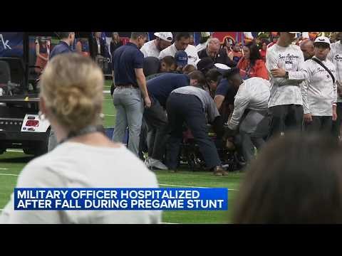 Military officer hospitalized after fall during pregame stunt