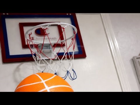 Mini basketball hoop trick shots