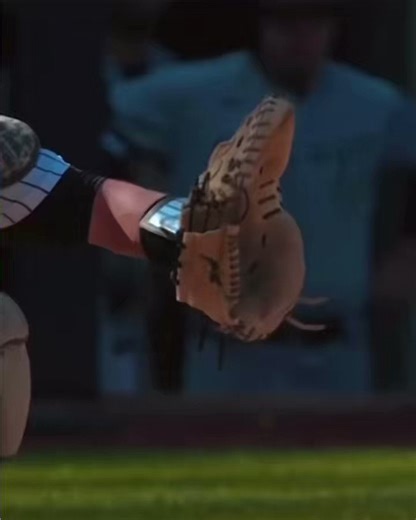 An unreal close up of a catcher’s glove receiving a 100mph fastball.