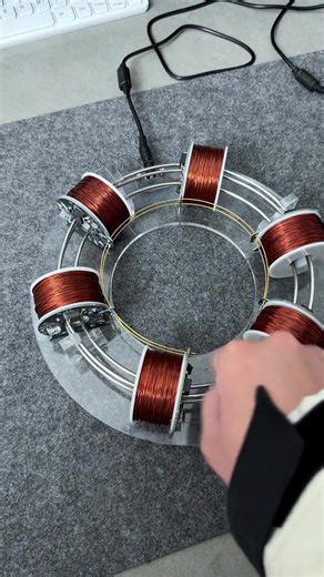 Check out this mini - particle accelerator model! It’s a fascinating piece of science - inspired craftsmanship. Just like in a real - life particle accelerator, where multiple coils work in sequence to give particles a boost, this model mimics that concept with its copper - wound coils. The precision and design are truly eye - catching. It’s not just a model; it’s a glimpse into the amazing world of particle physics. Who else is as intrigued by the wonders of science as I am? #ParticleAccelerato