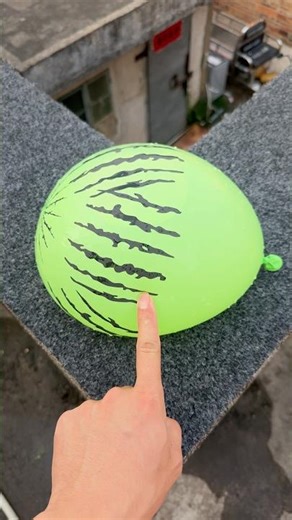 Experiment: Will a water balloon explode if it rolls down a tall building? 💥🎈 #balloon