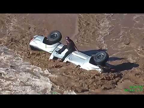Driver Airlifted To Safety After Car Swept Away By Flood