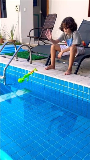 The alien fell into the pool.