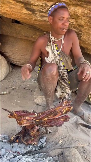 Hadzabe bushmen traditional favorite snack is bush bbq